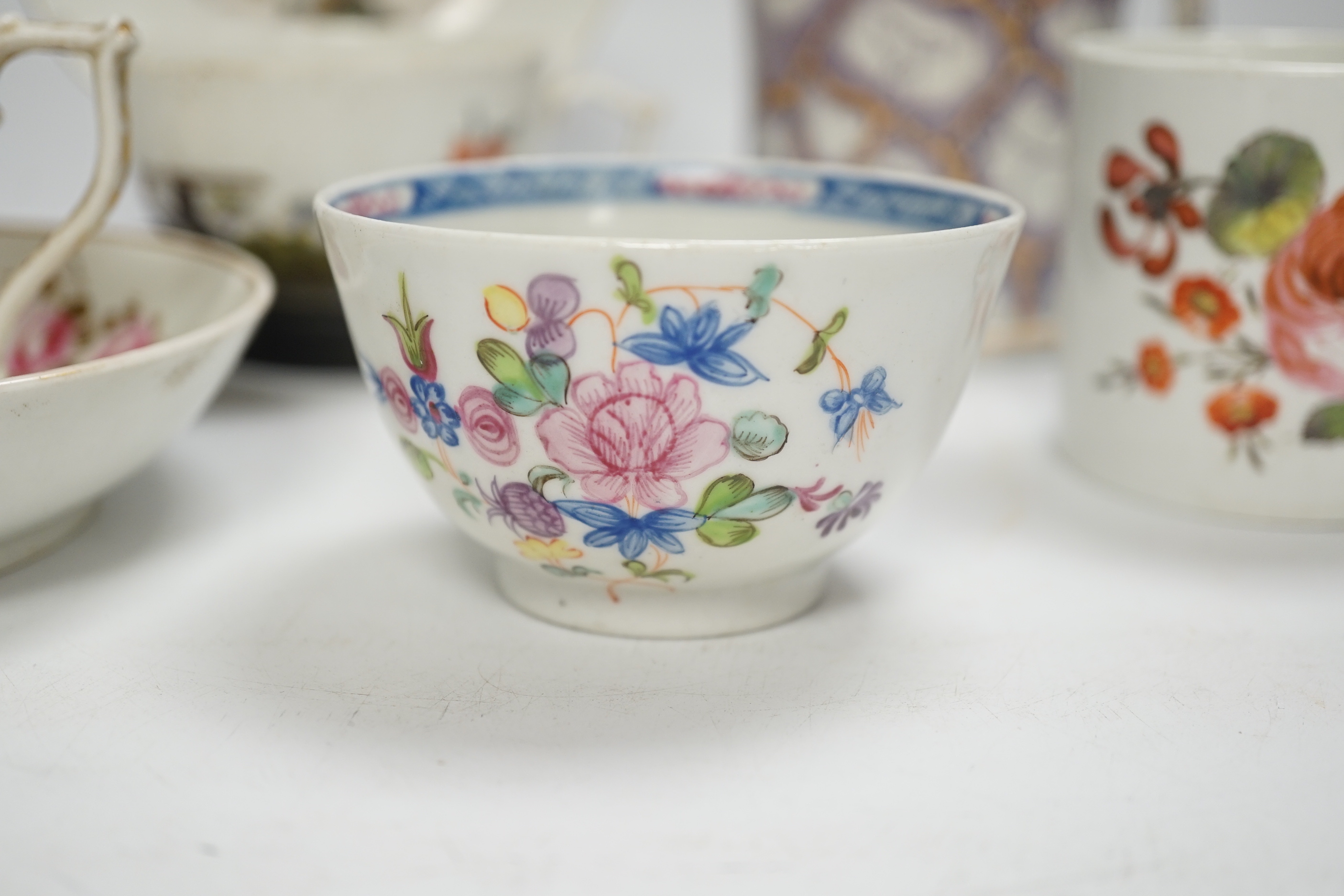 Two Derby porcelain coffee cans and one saucer, a tea bowl, a pearlware mug and a mid 18th century Meissen cup and saucer, tallest mug 8cm high